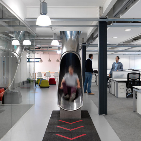The Workshop offices with a slide through the centre by Guy Holloway