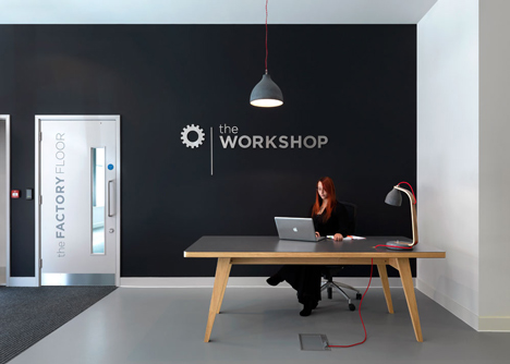 The Workshop offices with a slide through the centre by Guy Holloway
