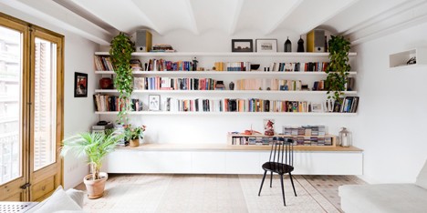 Barcelona apartment by Bach Arquitectes with colourful floor tiles arranged in stripes