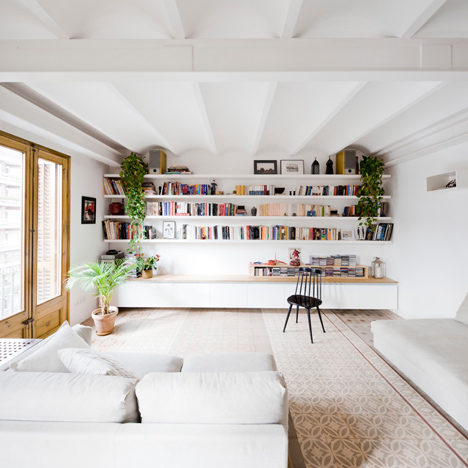 Barcelona apartment by Bach Arquitectes with colourful floor tiles arranged in stripes