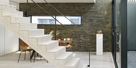 Blackbox mews house by Form_art Architects has brick walls inside and out