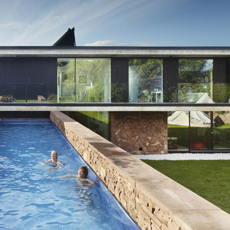 Coastal concrete house on a red sandstone base by ShedKM