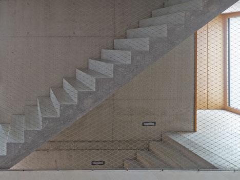 Stuttgart house by (se)arch with shingle-clad walls and a triple-height art gallery
