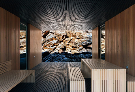 Woodland retreat by Béres Architects nestles up against a jagged rock face