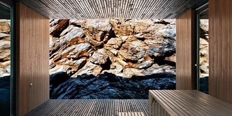 Woodland retreat by Béres Architects nestles up against a jagged rock face