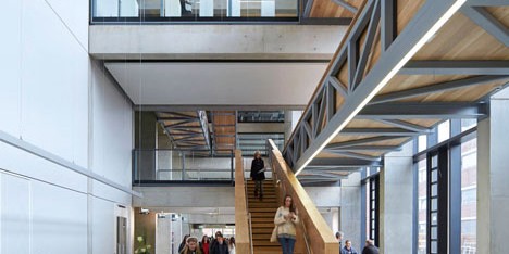 Manchester Metropolitan University art school extension with wooden stairs and bridges by Feilden Clegg Bradley Studios