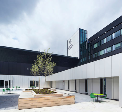 Manchester Metropolitan University art school extension with wooden stairs and bridges by Feilden Clegg Bradley Studios