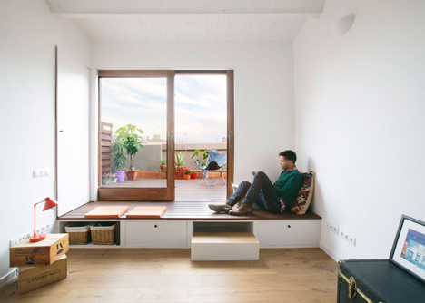 Nook Architects add patterned floor tiles and window seat to Barcelona apartment renovation
