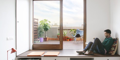 Nook Architects add patterned floor tiles and window seat to Barcelona apartment renovation