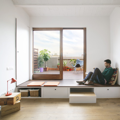 Nook Architects add patterned floor tiles and window seat to Barcelona apartment renovation