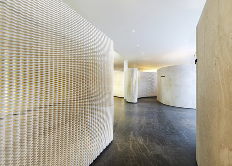 Southcape golf clubhouse by Mass Studies features curving concrete canopies