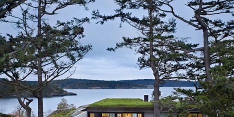 Concrete house by Olson Kundig Architects cuts into a rocky outcrop