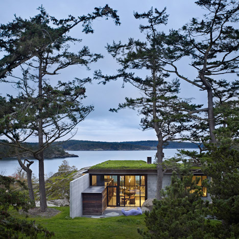 Concrete house by Olson Kundig Architects cuts into a rocky outcrop