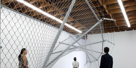 Twisting barbed wire fence installed by Didier Faustino at Cincinnatis Contemporary Arts Center