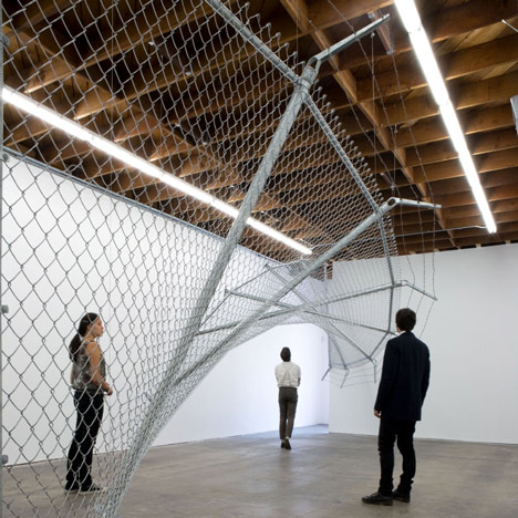 Twisting barbed wire fence installed by Didier Faustino at Cincinnatis Contemporary Arts Center
