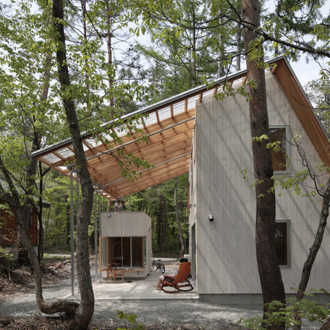 Cedar-clad villa by Naka Studio shelters a huge terrace beneath its roof