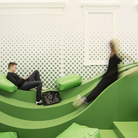 Wavy green lounge in a Solvenian school by Svet Vmes Architects