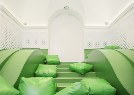Wavy green lounge in a Solvenian school by Svet Vmes Architects