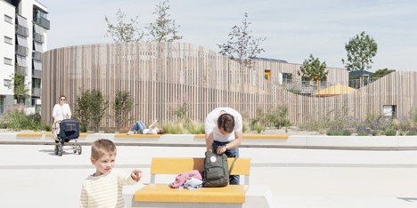 Timber-clad kindergarten by Behnisch Architekten opens in new housing district