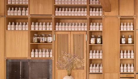 Buero Wagner suspends bottles of foraged ingredients from ceiling of cocktail bar