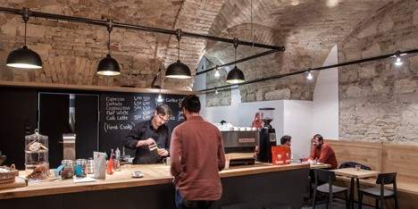 Budapest cafe with vaulted brick ceilings by Spora Architects