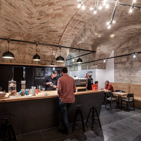 Budapest cafe with vaulted brick ceilings by Spora Architects