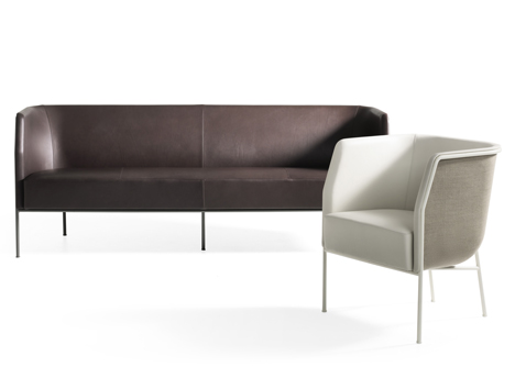 Cajal sofas and armchair by Gunilla Allard balance the seat on a thin metal frame