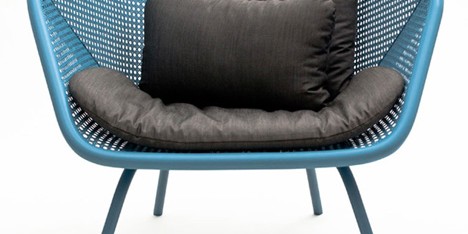 Colony armchair by Skrivo mixes steam-bent wood and rattan