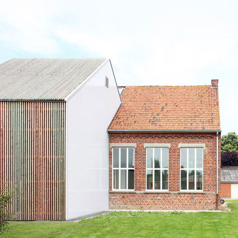 Community Centre Woesten by Atelier Tom Vanhee has a contrasting gabled extension