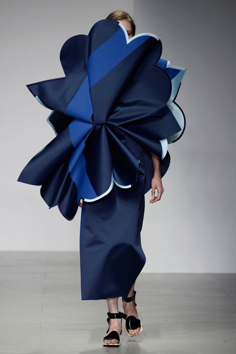 Giant flowers in Ondrej Adamek's graduate fashion collection obscure models