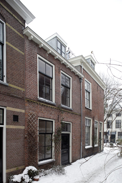 Unknown Architects updates 200-year-old house with twisting staircase and wooden furniture