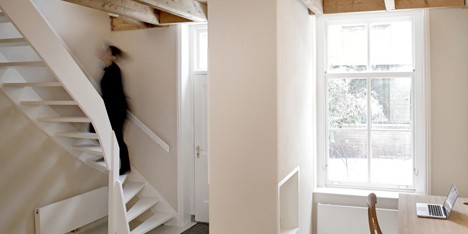 Unknown Architects updates 200-year-old house with twisting staircase and wooden furniture