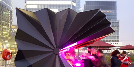 Folded metal kiosks by Make open like a paper fan
