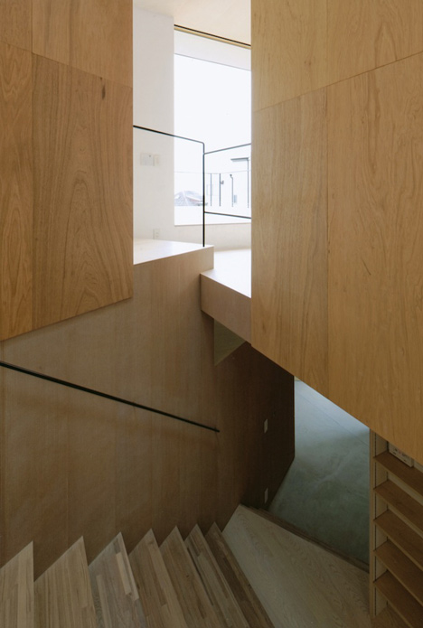 Krampon house by Shogo Aratani climbs over a rocky site