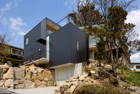 Krampon house by Shogo Aratani climbs over a rocky site