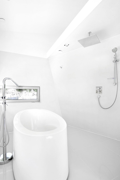 Asymmetric holiday homes by Studio Koossino feature bright yellow walls