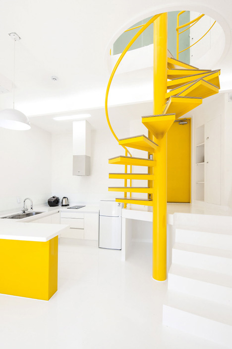 Asymmetric holiday homes by Studio Koossino feature bright yellow walls