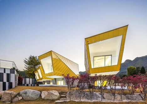 Asymmetric holiday homes by Studio Koossino feature bright yellow walls