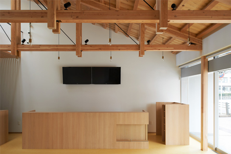 O Pharmacy by Ninkipen! features exposed wooden ceiling