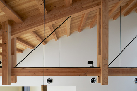 O Pharmacy by Ninkipen! features exposed wooden ceiling