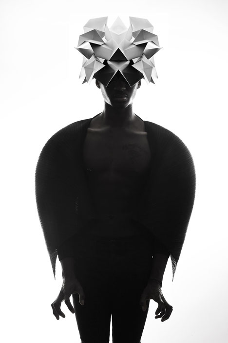 Origami headgear folded to resemble mythological creatures