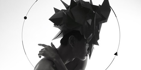 Origami headgear folded to resemble mythological creatures