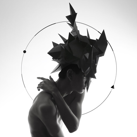Origami headgear folded to resemble mythological creatures