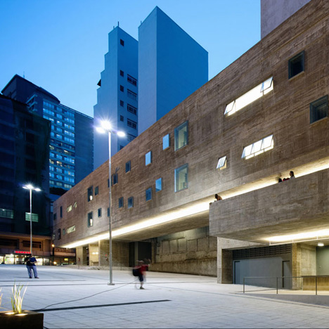 Praca das Artes by Brasil Arquitetura features concrete boxes projecting over a public plaza