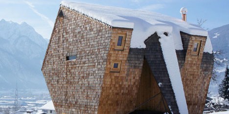 Alpine holiday cabin by Peter Jungmann has metal feet and a beak