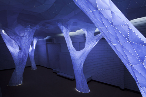 Glowing indoor forest made from paper by Orproject