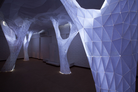Glowing indoor forest made from paper by Orproject