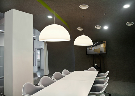Colourful pods house meeting rooms in IT firm offices by Za Bor Architects