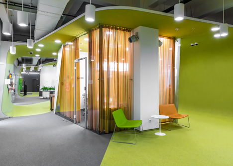 Colourful pods house meeting rooms in IT firm offices by Za Bor Architects