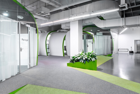 Colourful pods house meeting rooms in IT firm offices by Za Bor Architects